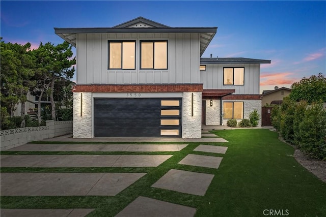3550 Goldenrod Cir, Seal Beach, CA 90740 - contemporary home featuring board and batten siding, an attached garage, and driveway