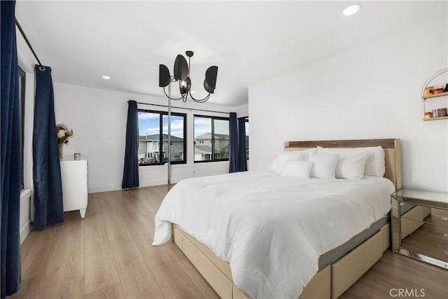 3550 Goldenrod Cir, Seal Beach, CA 90740 - bedroom featuring wood finished floors, recessed lighting, and a chandelier