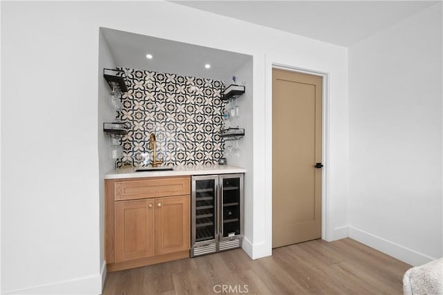 3550 Goldenrod Cir, Seal Beach, CA 90740 - indoor dry bar featuring beverage cooler, light wood-style flooring, backsplash, baseboards, and recessed lighting