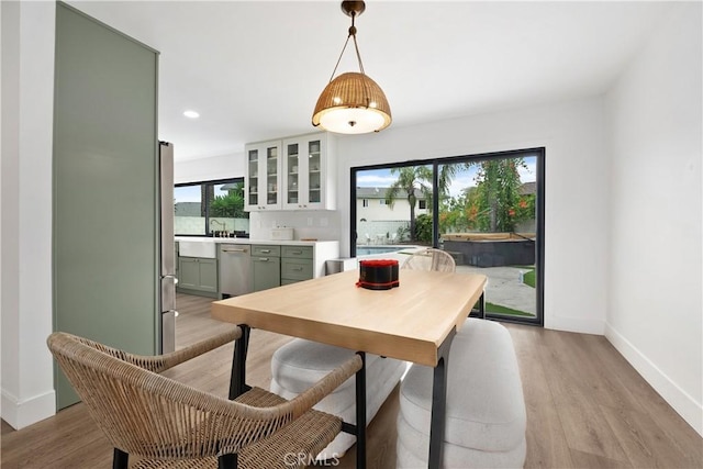 3550 Goldenrod Cir, Seal Beach, CA 90740 - dining space with baseboards, light wood-type flooring, and recessed lighting