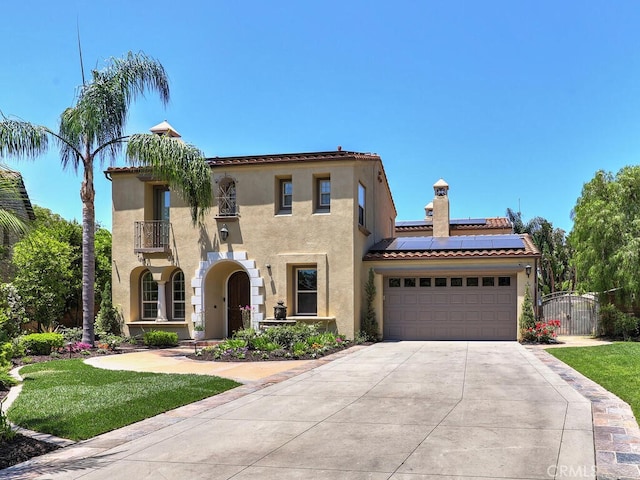 1 Lennox Ct, Ladera Ranch, CA 92694 - mediterranean / spanish house with a balcony, stucco siding, solar panels, a tile roof, and concrete driveway