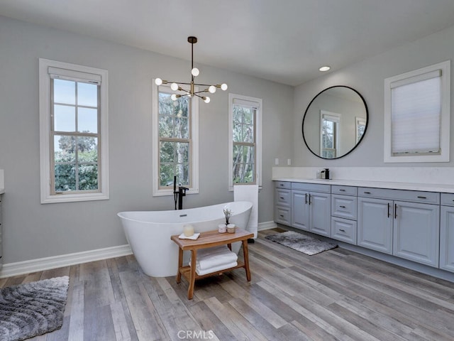1 Lennox Ct, Ladera Ranch, CA 92694 - full bath featuring vanity, a chandelier, plenty of natural light, a freestanding bath, and recessed lighting