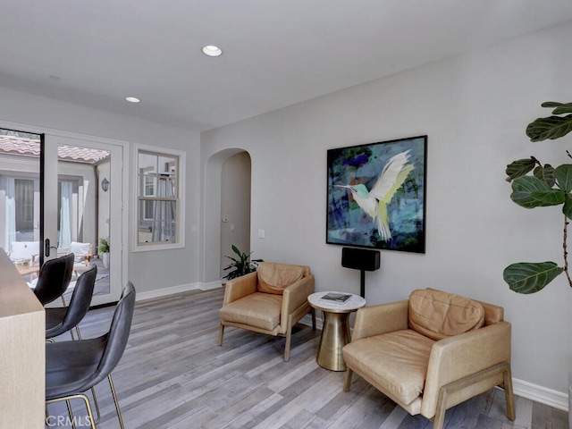 1 Lennox Ct, Ladera Ranch, CA 92694 - sitting room featuring arched walkways, light wood-style flooring, baseboards, and recessed lighting