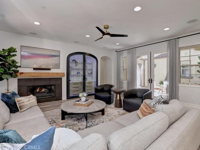 1 Lennox Ct, Ladera Ranch, CA 92694 - living area featuring french doors, recessed lighting, wood finished floors, ceiling fan, and arched walkways