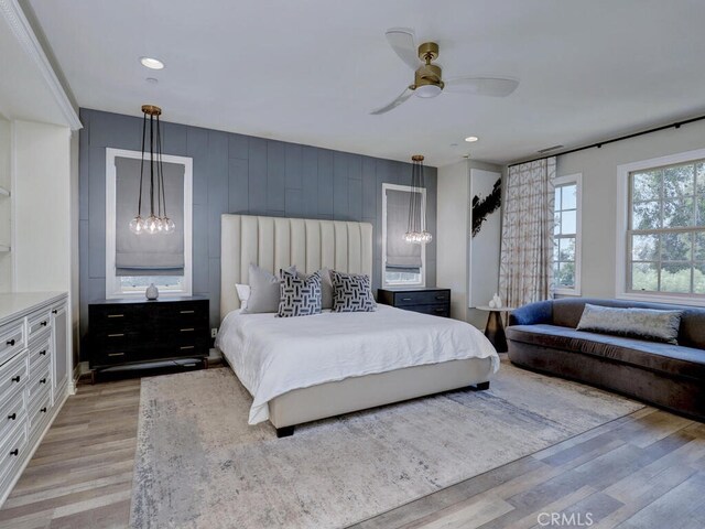 1 Lennox Ct, Ladera Ranch, CA 92694 - bedroom featuring light wood-type flooring, recessed lighting, a chandelier, and a ceiling fan