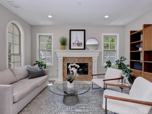 1 Lennox Ct, Ladera Ranch, CA 92694 - living area with plenty of natural light, a tiled fireplace, baseboards, recessed lighting, and wood finished floors