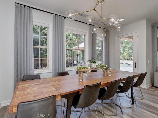 1 Lennox Ct, Ladera Ranch, CA 92694 - dining area with a chandelier, light wood-type flooring, plenty of natural light, and baseboards