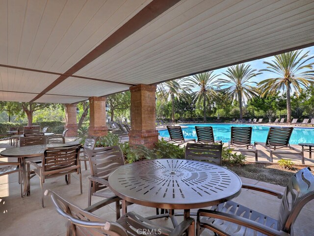 1 Lennox Ct, Ladera Ranch, CA 92694 - view of patio with outdoor dining area and a community pool
