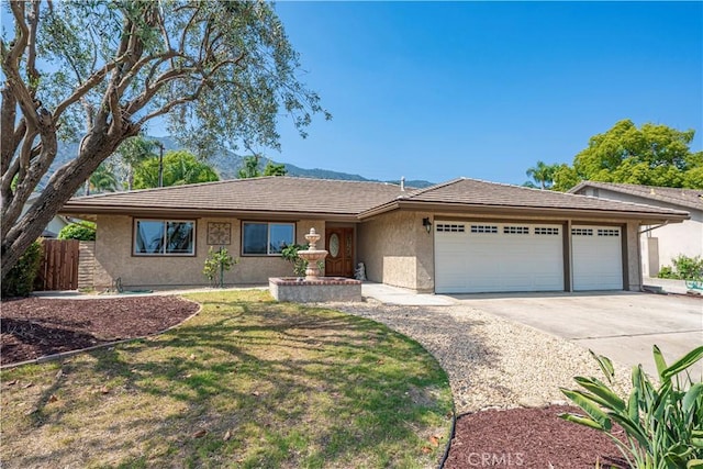 427 W Northridge Ave, Glendora, CA 91741 - ranch-style house with a garage, stucco siding, and driveway