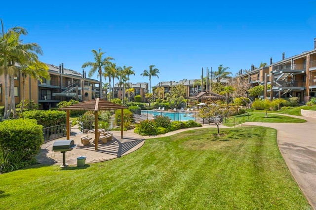 4006 Layang Layang Cir Unit E, Carlsbad, CA 92008 - view of home's community with a yard, a swimming pool, and a gazebo