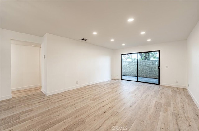 611 W 1st St Unit 101, Santa Ana, CA 92701 - empty room featuring light wood-style floors, recessed lighting, and baseboards