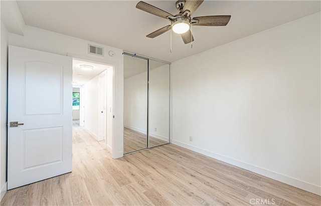 611 W 1st St Unit 101, Santa Ana, CA 92701 - unfurnished bedroom featuring light wood finished floors, baseboards, and a closet