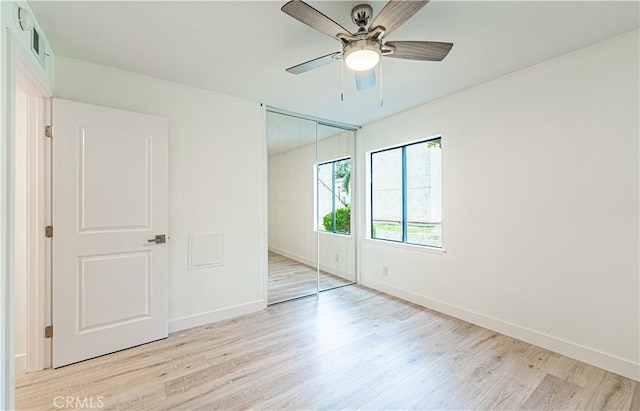 611 W 1st St Unit 101, Santa Ana, CA 92701 - unfurnished bedroom featuring light wood-type flooring, baseboards, a closet, and ceiling fan