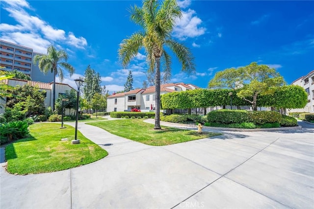 611 W 1st St Unit 101, Santa Ana, CA 92701 - surrounding community featuring a lawn and a residential view