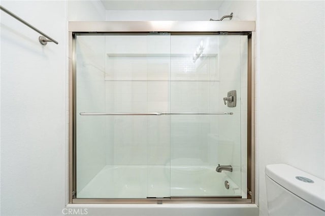 611 W 1st St Unit 101, Santa Ana, CA 92701 - bathroom with bath / shower combo with glass door and toilet