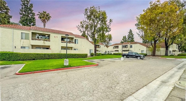 611 W 1st St Unit 101, Santa Ana, CA 92701 - view of building exterior with uncovered parking and a residential view