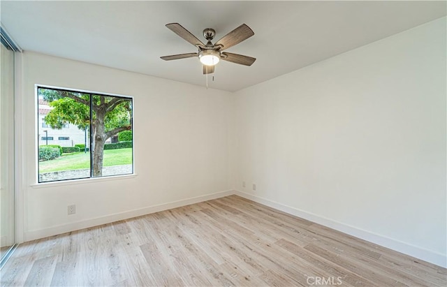 611 W 1st St Unit 101, Santa Ana, CA 92701 - empty room with light wood finished floors, baseboards, and ceiling fan