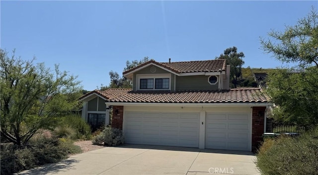 13031 Jolette Ave, Granada Hills, CA 91344 - view of front facade featuring a tile roof, driveway, brick siding, and a garage