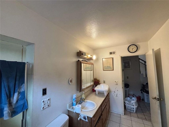 108 Leoma Ln, Chula Vista, CA 91911 - full bathroom featuring double vanity, toilet, tile patterned flooring, and a shower