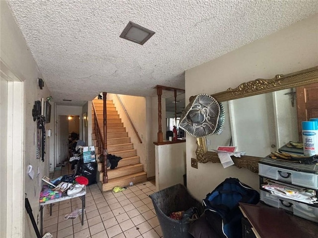 108 Leoma Ln, Chula Vista, CA 91911 - staircase with tile patterned flooring and a textured ceiling