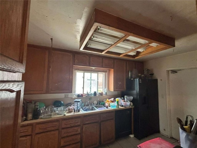 108 Leoma Ln, Chula Vista, CA 91911 - kitchen featuring a sink, freestanding refrigerator, light countertops, and brown cabinetry