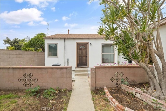 10931 S Burl Ave, Inglewood, CA 90304 - view of front facade featuring stucco siding and a shingled roof