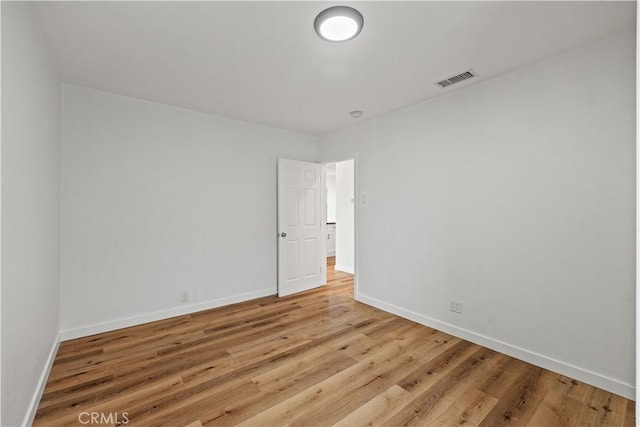 10931 S Burl Ave, Inglewood, CA 90304 - empty room with baseboards and light wood-type flooring