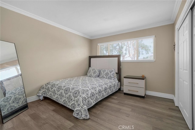 20605 Broadview Dr, Perris, CA 92570 - bedroom with multiple windows, wood finished floors, a closet, ornamental molding, and baseboards