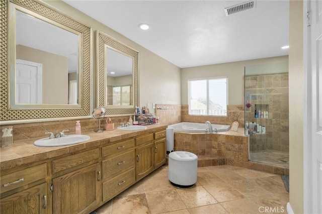 20605 Broadview Dr, Perris, CA 92570 - full bathroom with a bath, double vanity, a tile shower, stone tile flooring, and decorative backsplash
