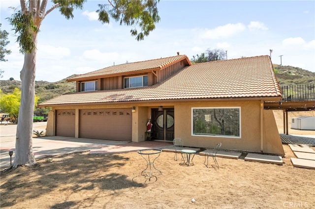 20605 Broadview Dr, Perris, CA 92570 - view of front of house featuring a tiled roof, stucco siding, and driveway