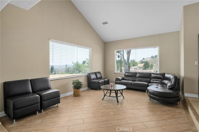 20605 Broadview Dr, Perris, CA 92570 - living area with plenty of natural light, baseboards, and high vaulted ceiling