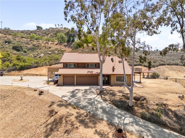 20605 Broadview Dr, Perris, CA 92570 - view of front of property with a tiled roof, an attached garage, driveway, and stucco siding
