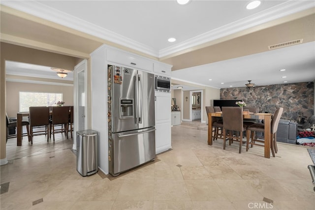 20605 Broadview Dr, Perris, CA 92570 - kitchen featuring appliances with stainless steel finishes, ornamental molding, white cabinetry, recessed lighting, and open floor plan