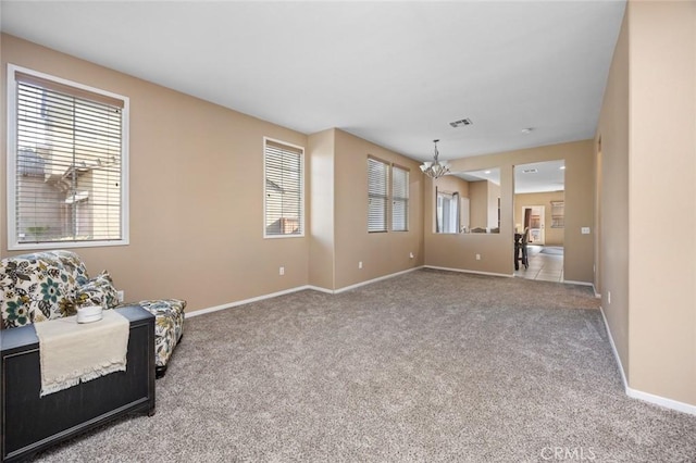 3762 Almansa Way, Perris, CA 92571 - unfurnished living room with carpet floors, a chandelier, and baseboards