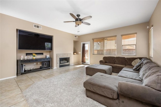 3762 Almansa Way, Perris, CA 92571 - living room featuring tile patterned floors, ceiling fan, baseboards, and a tiled fireplace