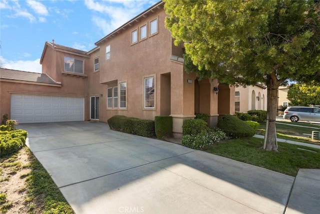 3762 Almansa Way, Perris, CA 92571 - view of front facade featuring concrete driveway, stucco siding, and a garage
