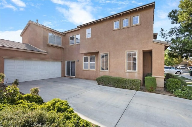 3762 Almansa Way, Perris, CA 92571 - rear view of property with driveway and stucco siding