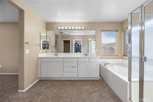 3762 Almansa Way, Perris, CA 92571 - bathroom featuring a garden tub, double vanity, carpet flooring, baseboards, and a shower stall
