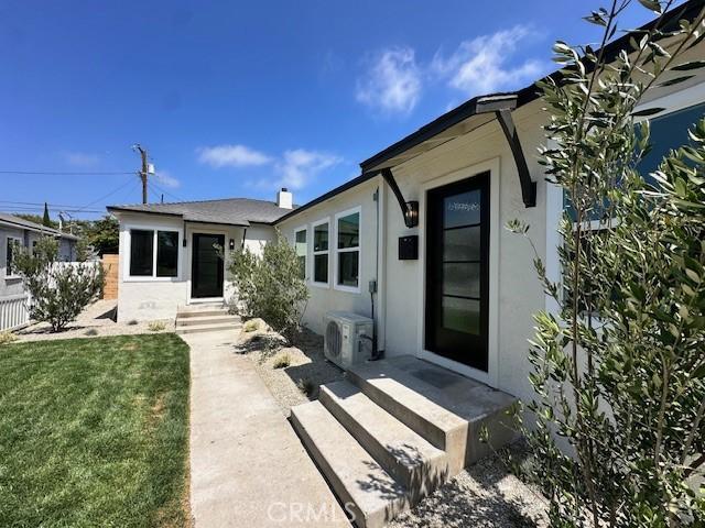 2510 Termino Ave, Long Beach, CA 90815 - back of house with stucco siding and a lawn