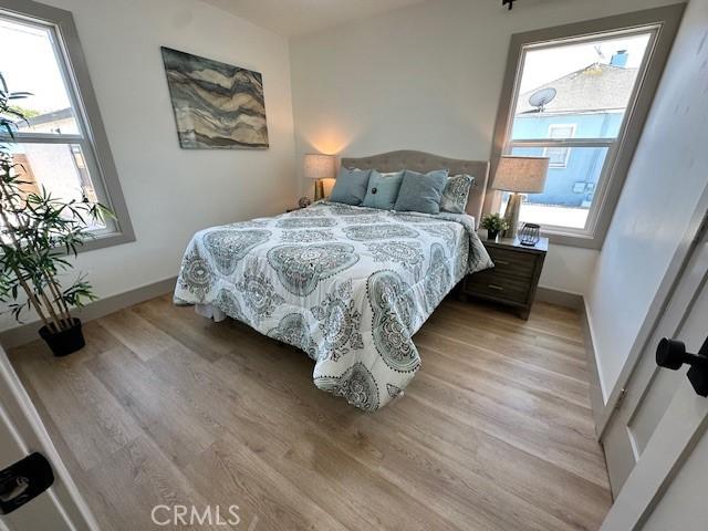 2510 Termino Ave, Long Beach, CA 90815 - bedroom featuring light wood-style floors and multiple windows