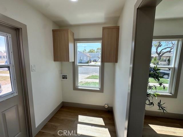 2510 Termino Ave, Long Beach, CA 90815 - washroom with hookup for a washing machine and dark wood-style flooring