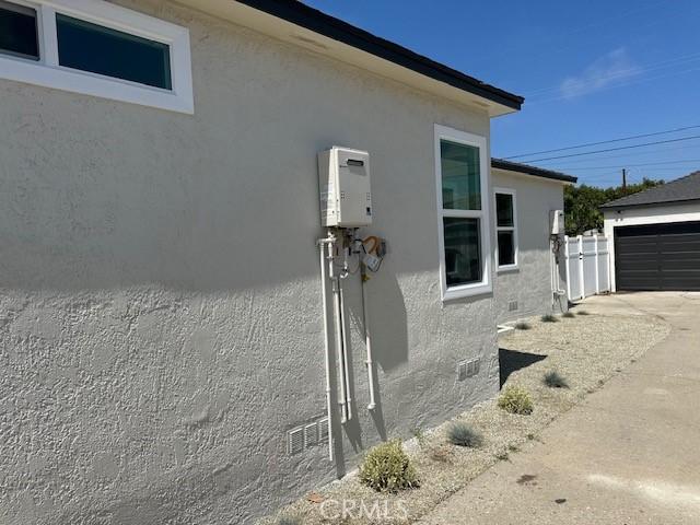 2510 Termino Ave, Long Beach, CA 90815 - view of side of home featuring stucco siding and a garage