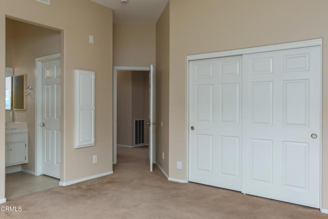 1724 Hilaria St, Oxnard, CA 93030 - unfurnished bedroom featuring light colored carpet, a closet, and baseboards