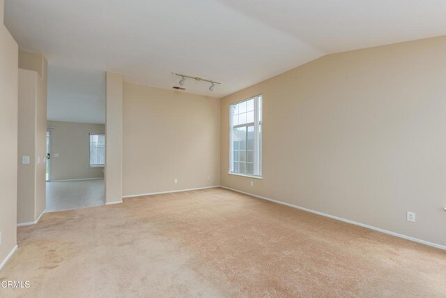 1724 Hilaria St, Oxnard, CA 93030 - empty room with light colored carpet, healthy amount of natural light, and baseboards
