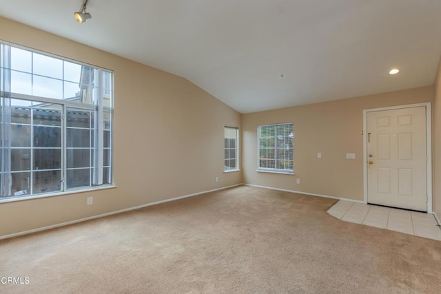 1724 Hilaria St, Oxnard, CA 93030 - empty room featuring carpet, plenty of natural light, lofted ceiling, baseboards, and recessed lighting