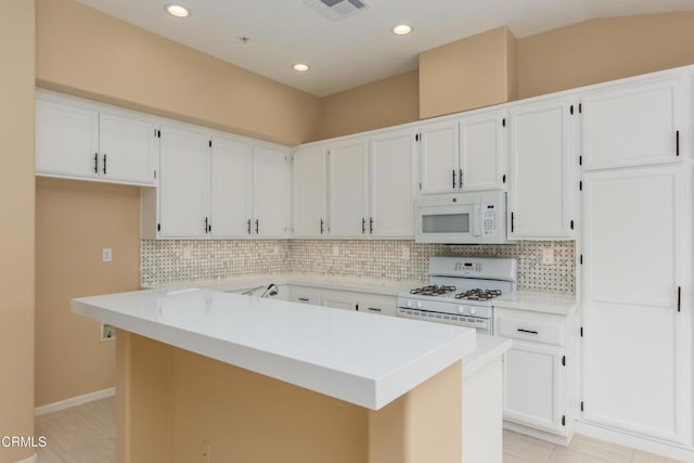 1724 Hilaria St, Oxnard, CA 93030 - kitchen featuring white appliances, decorative backsplash, white cabinets, and recessed lighting