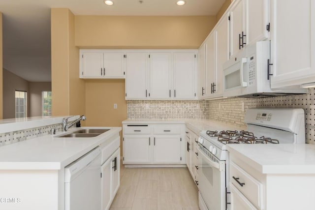 1724 Hilaria St, Oxnard, CA 93030 - kitchen with white appliances, a sink, white cabinets, decorative backsplash, and recessed lighting