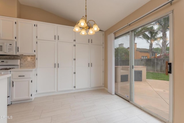 1724 Hilaria St, Oxnard, CA 93030 - unfurnished dining area with a chandelier and vaulted ceiling