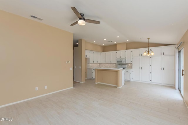1724 Hilaria St, Oxnard, CA 93030 - kitchen with white microwave, light countertops, a chandelier, open floor plan, and a ceiling fan