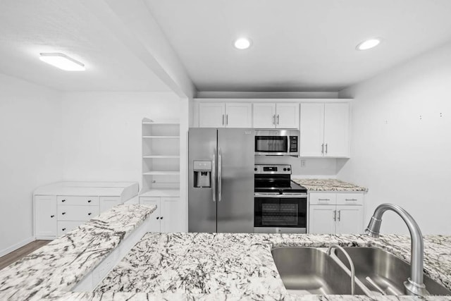 2920 Briarwood Rd Unit G12, Bonita, CA 91902 - kitchen featuring stainless steel appliances, a sink, white cabinetry, light stone countertops, and recessed lighting